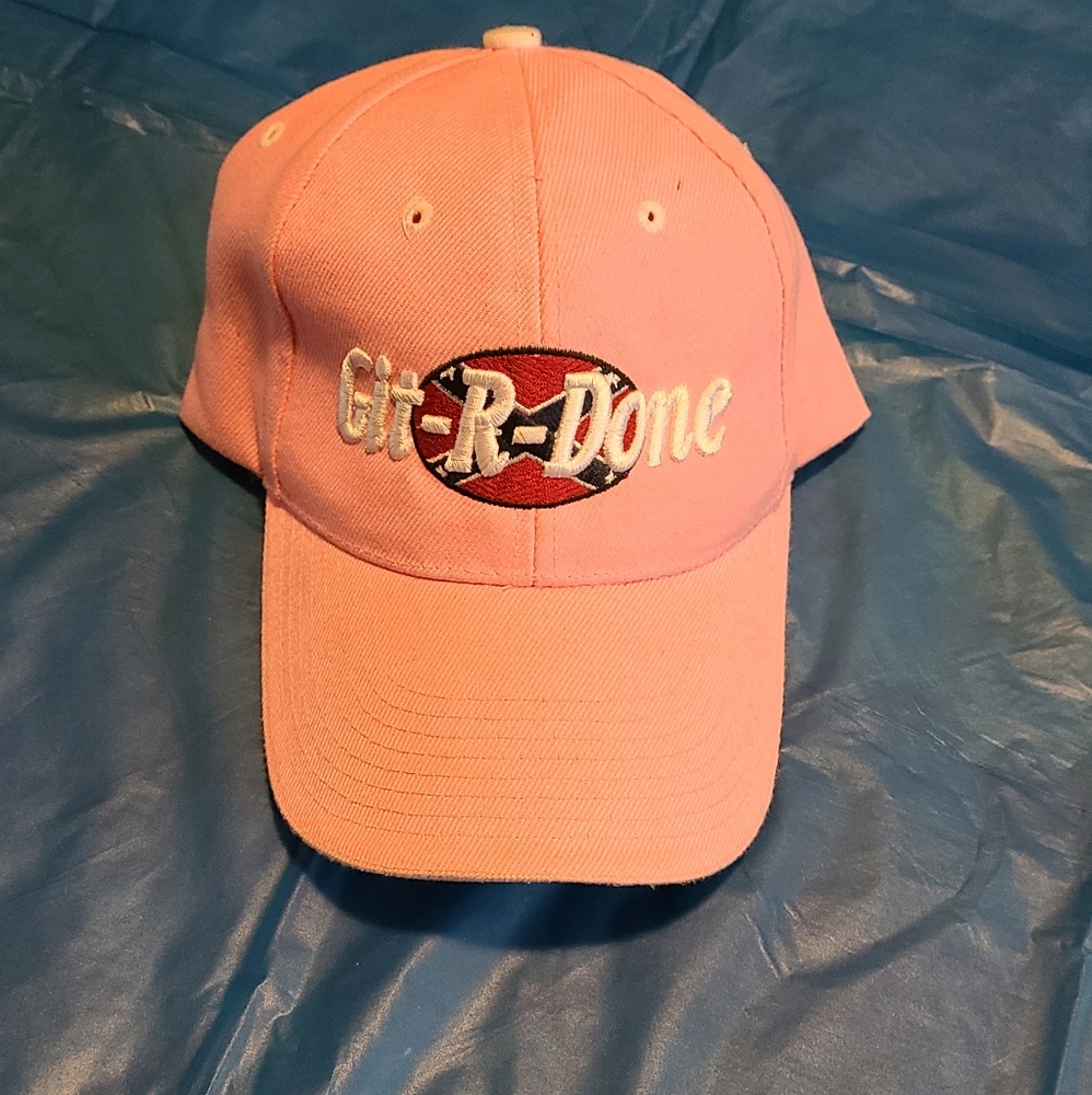 A pink ball cap style hat